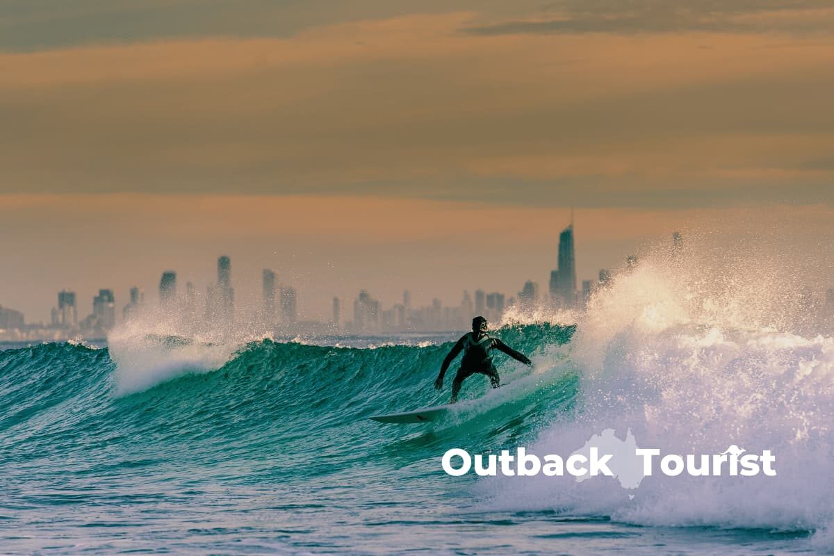 Surfers enjoying the beach by Brisbane